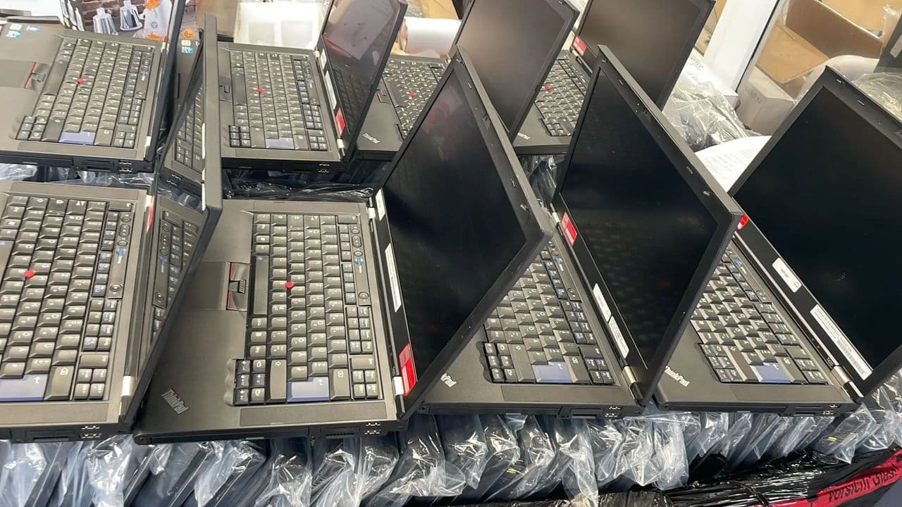 Lenovo L412 laptop lot — stacked units